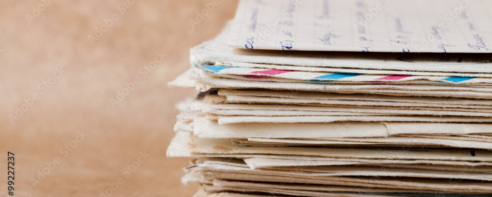 Stack of old envelopes and letters on kraft paper